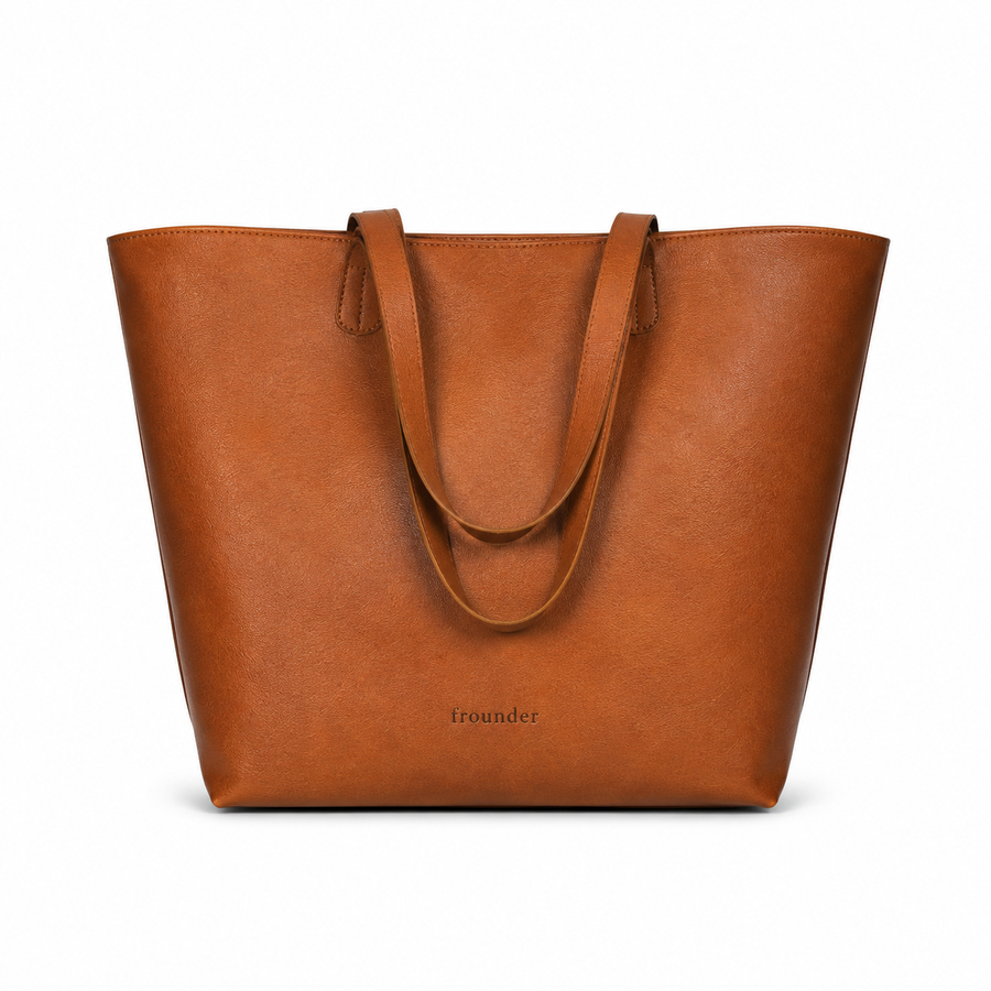 Front view of tan Daygrove with twin handles resting against the bag.