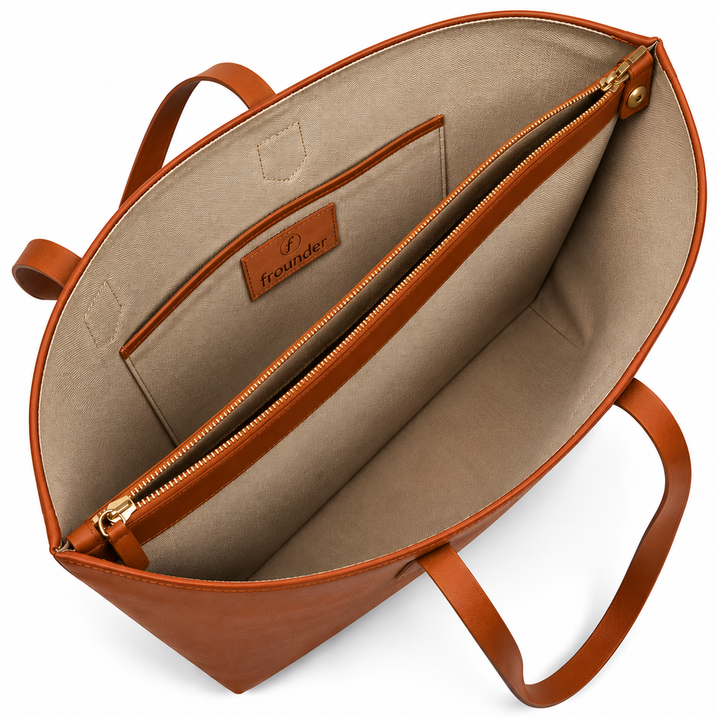 Tan Daygrove interior showing a central zipped divider and a side slip pocket.