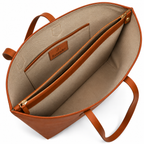 Tan Daygrove interior showing a central zipped divider and a side slip pocket.