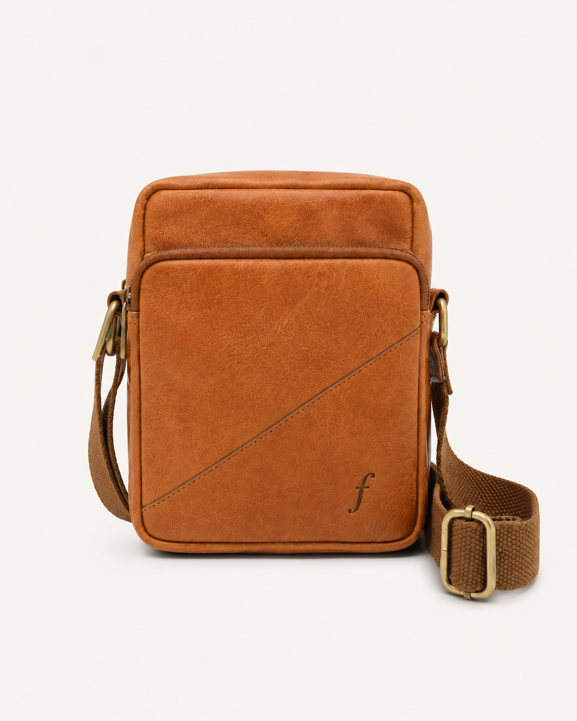Sprig crossbody bag showing its front zipped pocket and adjustable woven shoulder strap.