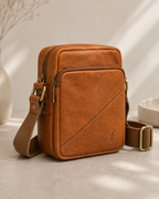 Angled view of Sprig showing separate main and front pocket zippers and side strap attachment.