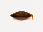 Twinleaf and Clay pouch opened to show the lined interior and a wide slip pocket.