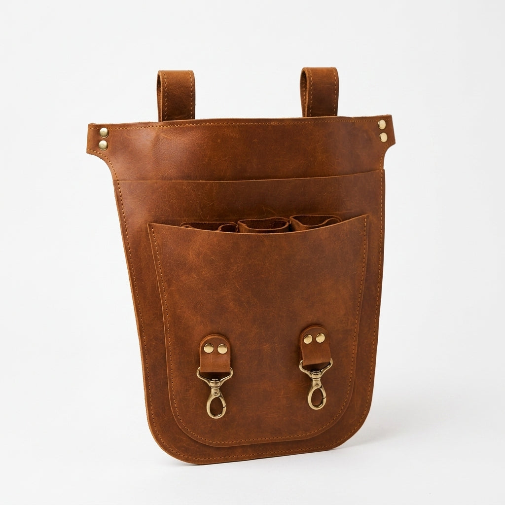 Brown Benchside Tool Bag upright, showing its upper loops, layered pockets and internal tool sleeves.