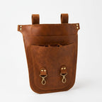 Brown Benchside Tool Bag upright, showing its upper loops, layered pockets and internal tool sleeves.