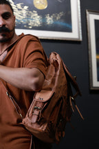 Crest carried over one shoulder, showing the side pocket and shoulder strap.