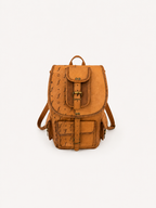 Crest straight-on front view with the main flap closed and shoulder straps visible at the sides.