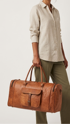 Oakpath carried by its twin handles, showing the front pocket and end profile.