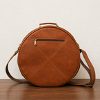 Rear view of the Woodnote Drum Bag, showing the horizontal zipped pocket and shoulder strap.
