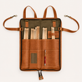 Backbeat Drumstick Bag unzipped and opened flat, with drumsticks in divided pockets, a pen loop, card window and clip-ended straps.