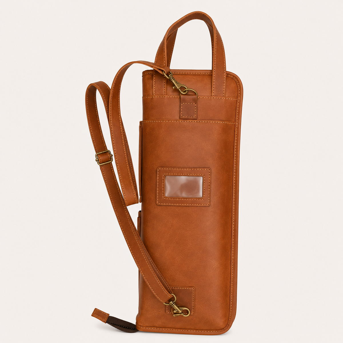 Closed Backbeat Drumstick Bag upright, showing its long shoulder strap, twin handles and exterior card window.