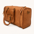 Ridgeline Weekender Duffel angled view showing the end panel, zip and shoulder-strap attachment ring.