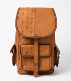 Roamwood backpack showing its rounded flap, front pocket and two side pockets.