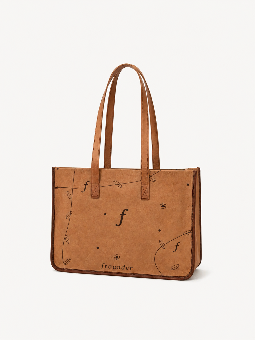 Meadow front view with twin shoulder handles, botanical pattern and stitched edges.