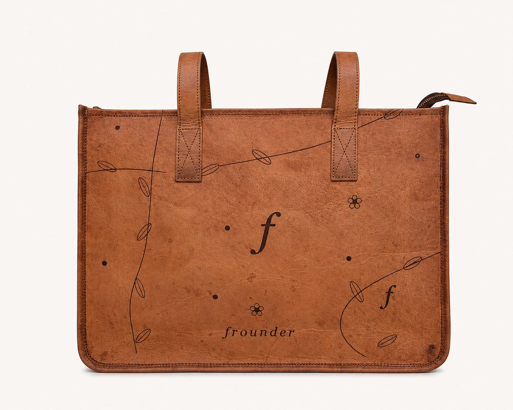 Meadow straight-on front view showing the botanical pattern and handle attachment stitching.