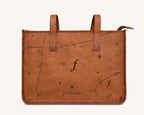 Meadow straight-on front view showing the botanical pattern and handle attachment stitching.