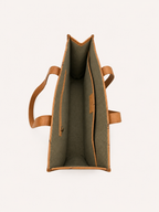 Meadow open interior with a zip pocket on one side and a broad slip pocket on the other.