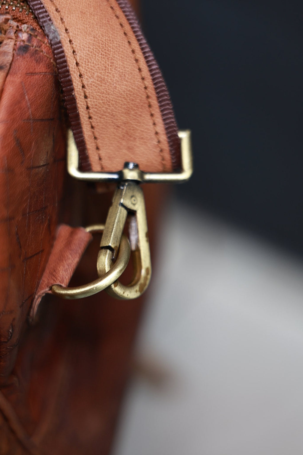 Timberline detachable shoulder-strap clip connected to its attachment ring.