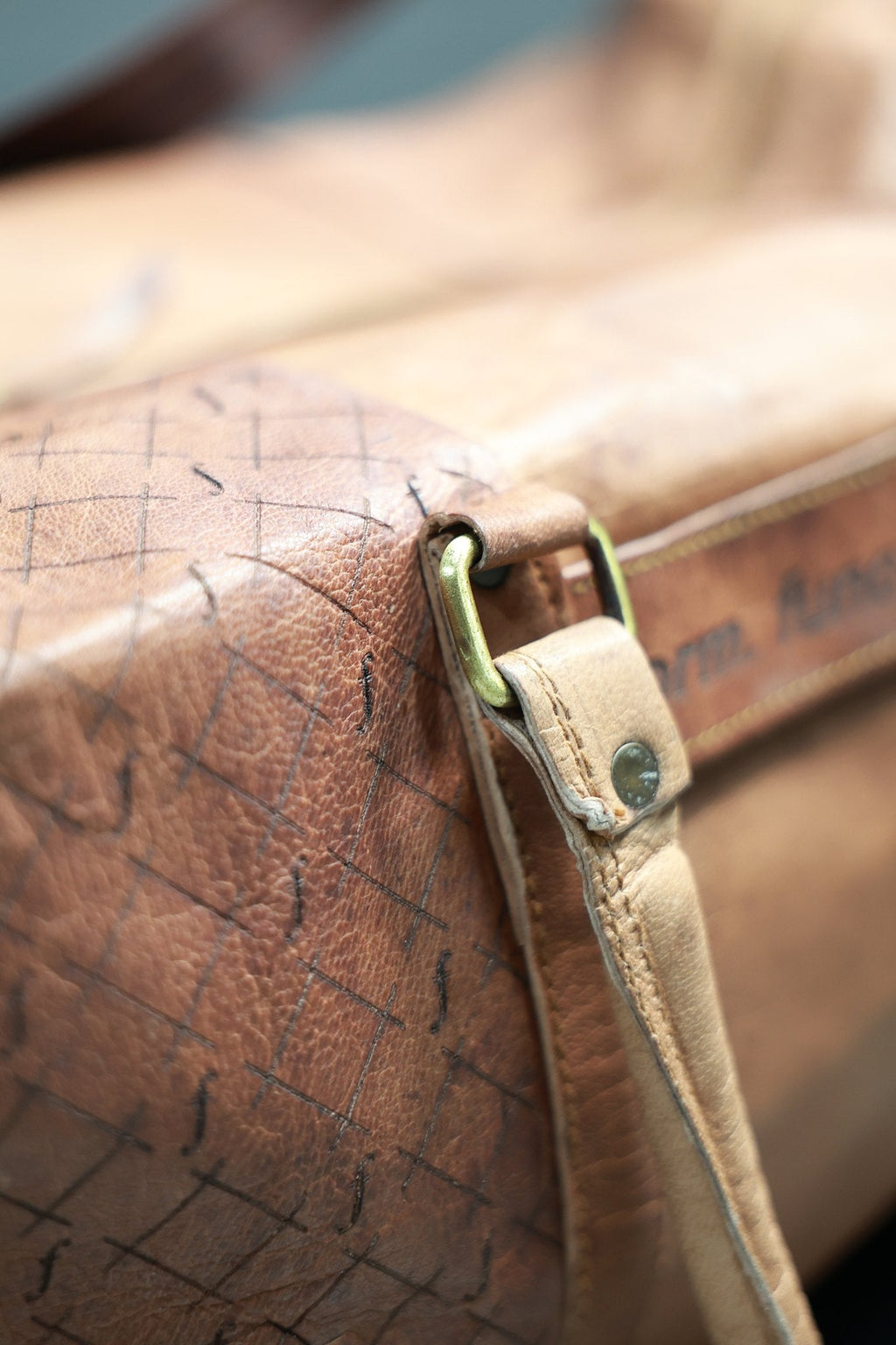 Close-up of the Timberline handle attachment, showing the rectangular ring, rivet and stitching.