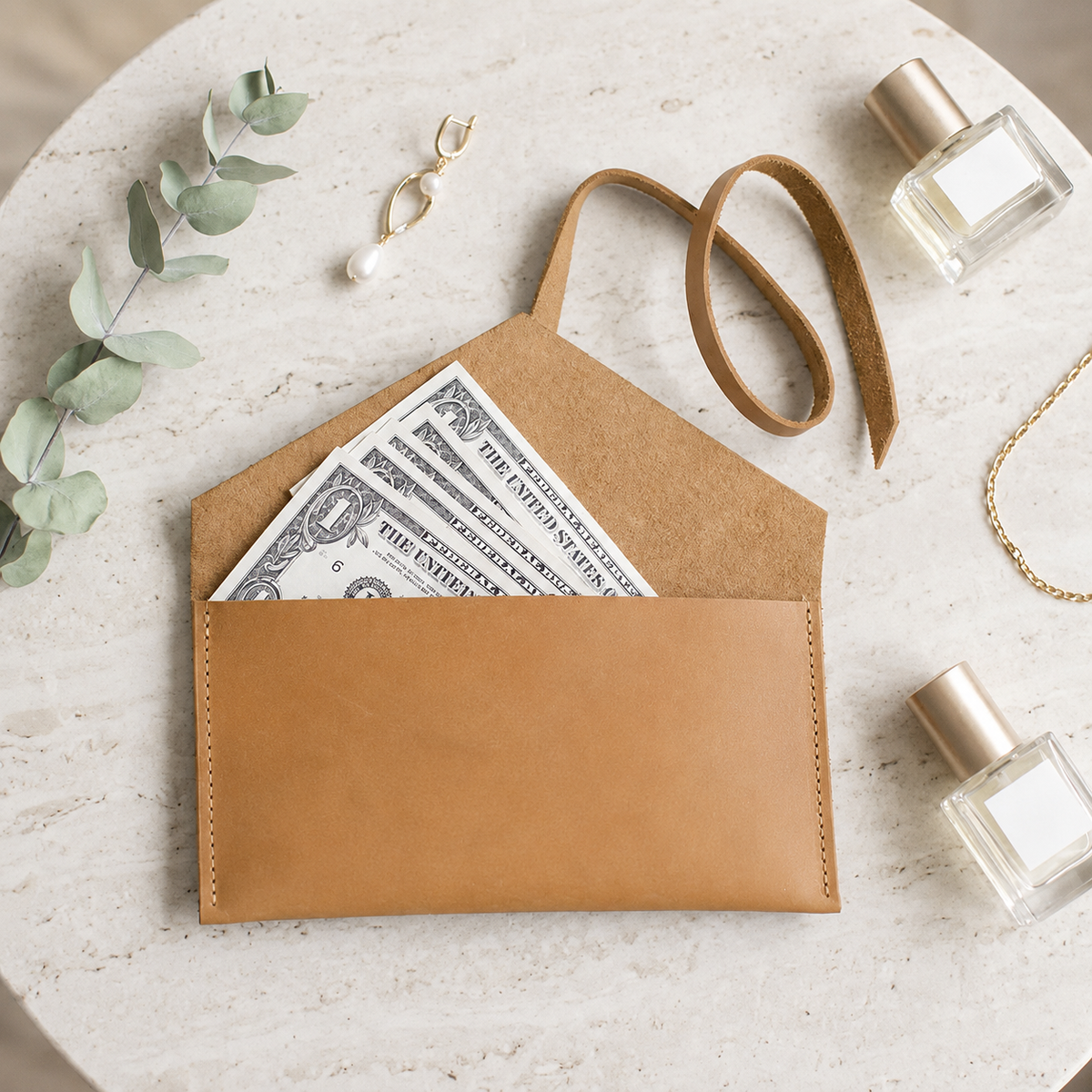 Pocketgrove clutch opened with banknotes illustrating its main pocket.