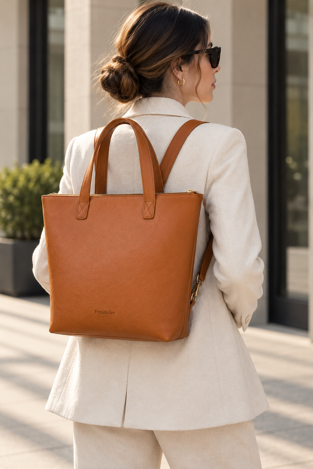 Switchgrove carried as a backpack, with the tote handles visible above the bag.