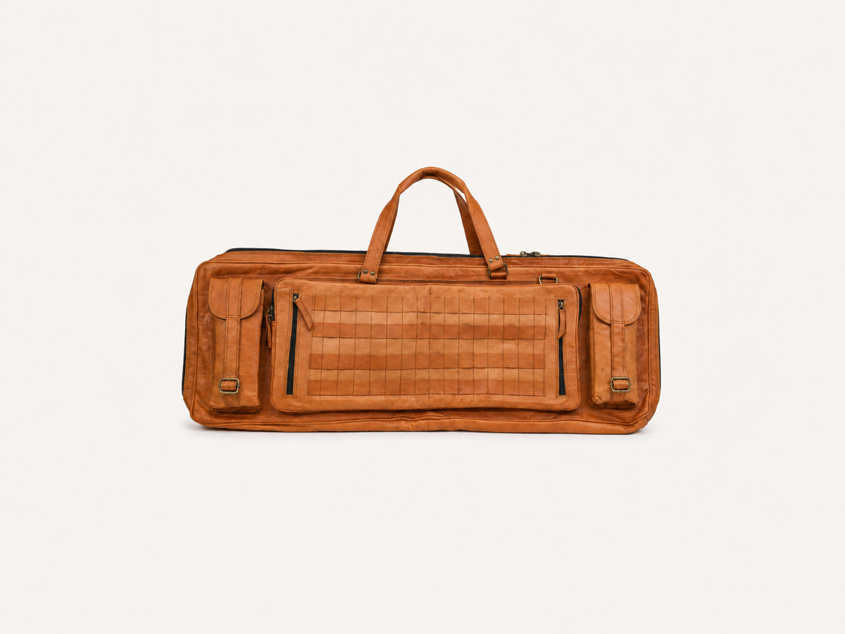 Fieldline carrying case showing twin handles, two buckled outer pockets and a large central zipped panel.