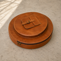 Resonance Cymbal Bag laid flat, showing its circular main compartment, smaller round front compartment and buckled accessory pocket.