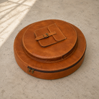 Resonance Cymbal Bag laid flat, showing its circular main compartment, smaller round front compartment and buckled accessory pocket.